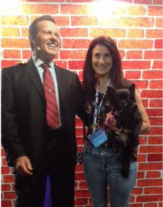 Young Living member Sharon Evans with a picture of founder D. Gary Young